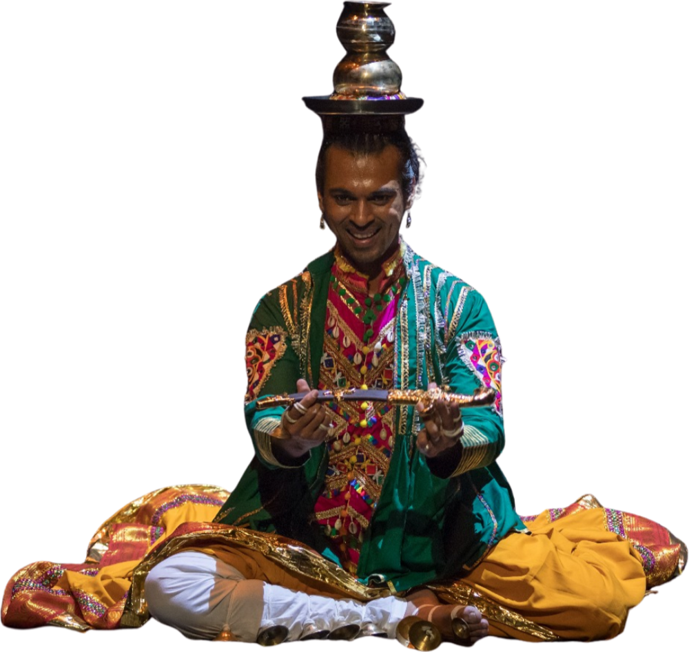 ABC artistic director Swapnil Dagliya performing Tera Taali, smiling with brass pots balanced on his head