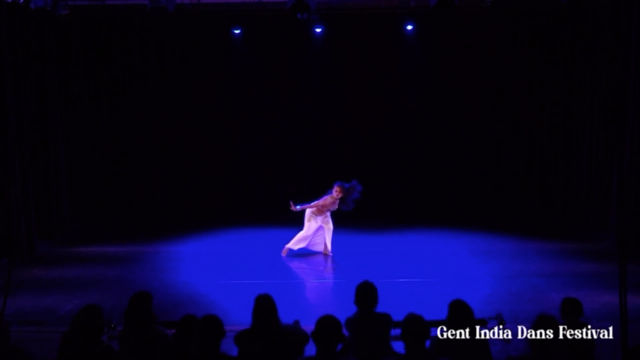 Shampa Gopikrishna performing under a blue wash